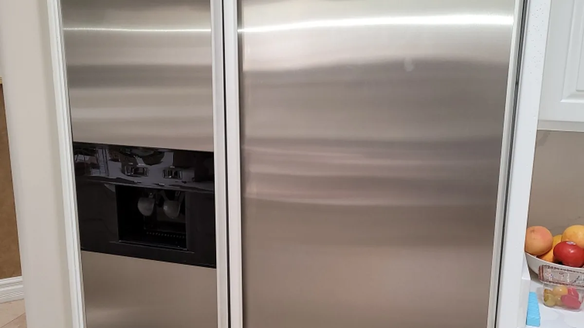 Factory-certified appliance repair technician servicing luxury refrigeration, laundry suites, and cooking ranges in Cupertino, CA